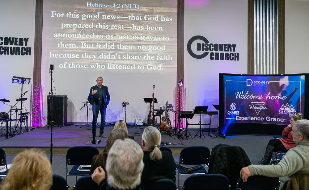 Steve McIntosh with congregation